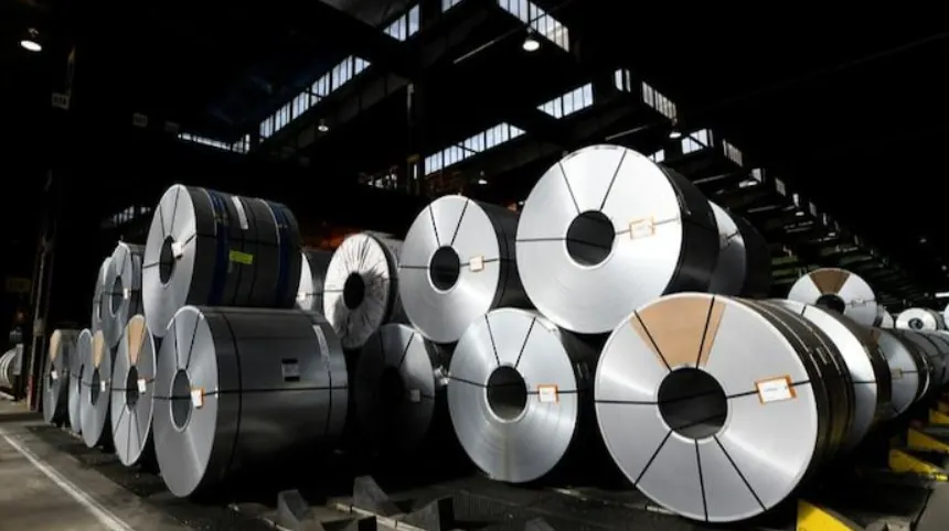 Heavy steel coil rolls staged in an industrial warehouse — Detroit 3PL specialized metals handling, storage, and flatbed coordination